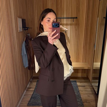 senior fashion editor Anna LaPlaca wearing Mango Selection pieces inside a store dressing room