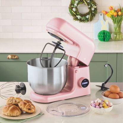 Aldi Stand Mixer in pink on kitchen worktop with mini eggs and hot cross buns