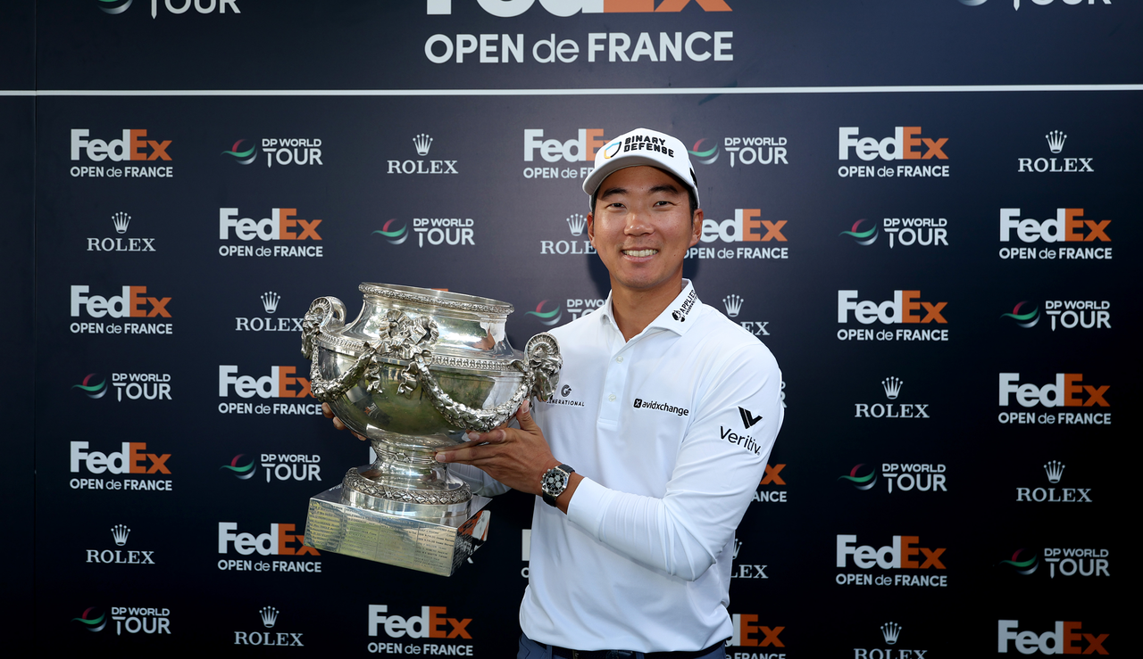 Michael Kim holds the FedEx Open de France trophy