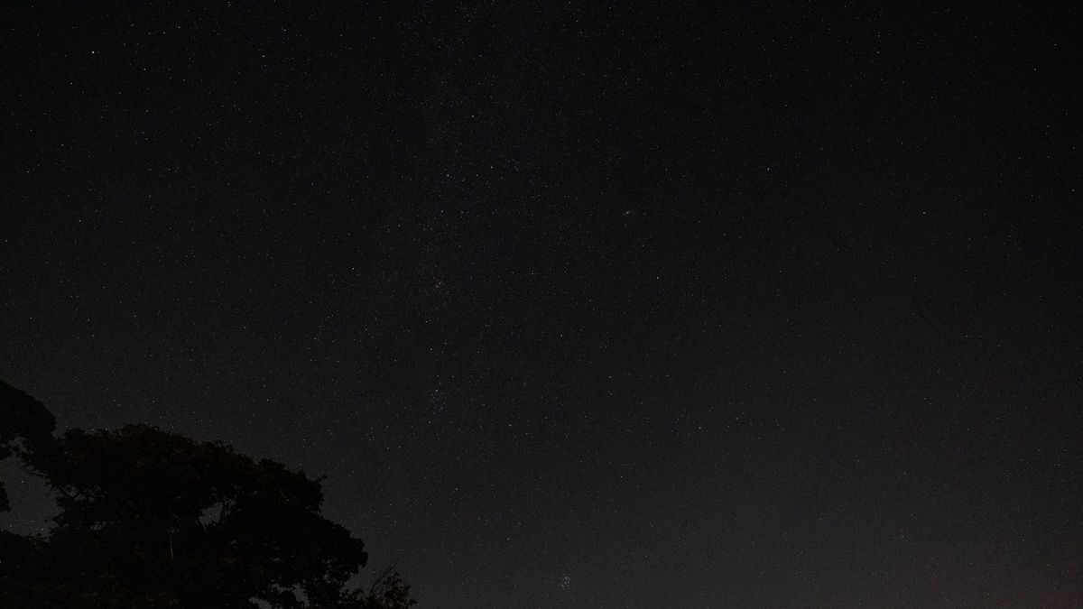 The Pleiades star cluster and the constellation Perseus in the starry night sky, as photographed by the Fujifilm GFX100S II.