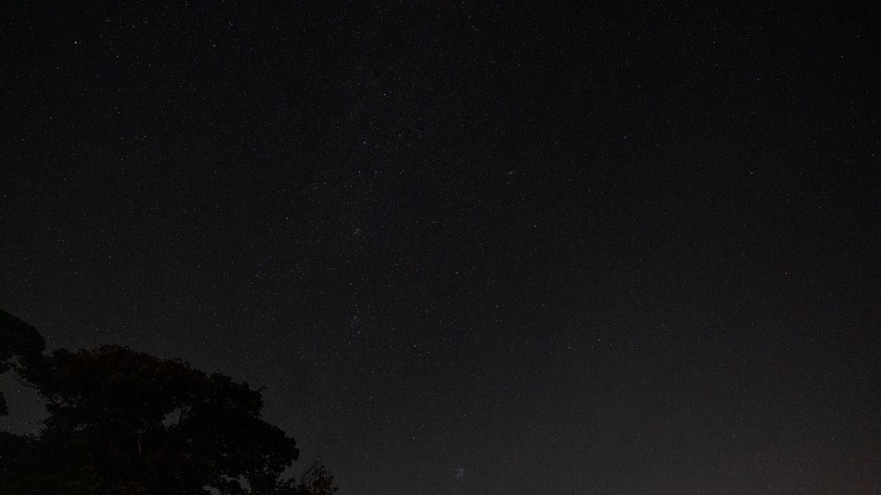 The Pleiades star cluster and the constellation Perseus in the starry night sky, as photographed by the Fujifilm GFX100S II.