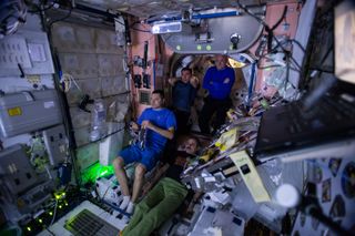 International Space Station Expedition 45 crewmembers watch an advance screening of "The Martian" movie on Sept. 19, 2015.
