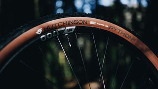 The Hutchison Python 3 tire side on with tan walls