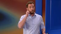 Rick Devens pretends to answer a phone call on Big Brother.