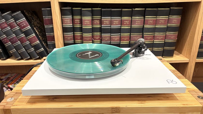 Rega Planar 6/Nd7 in white finish with blue vinyl record playing