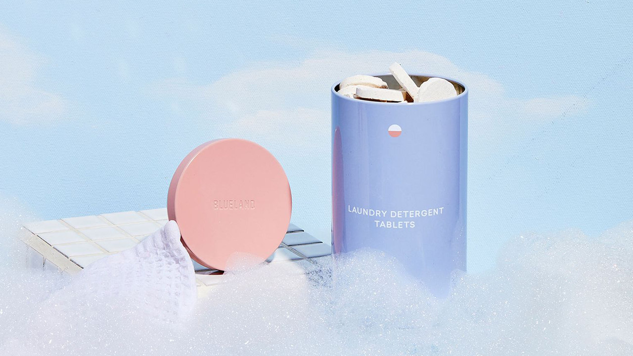 Blueland&#039;s laundry tin in a dreamy cloud setting surrounded by bubbles