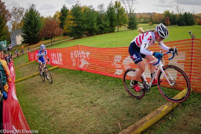 Katie Compton (Trek Cyclocross Collective) riding the log steps ahead of Nash