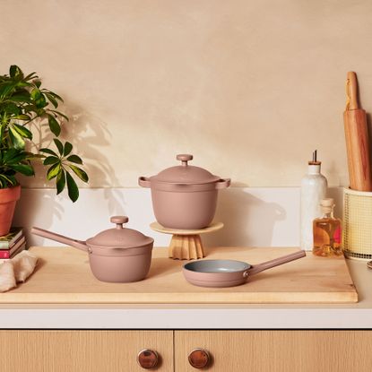 Three pink mini Our Place cookware items on countertop