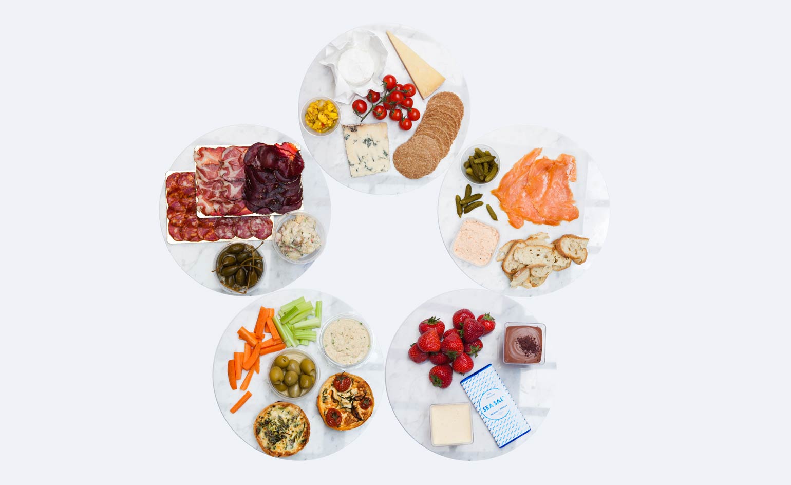 The case is filled with treats such as creamy cheeses and fruit trifles
