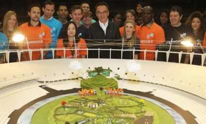 Olympic Games Opening Ceremony director Danny Boyle presents a model of his vision for the event, which resembles the British countryside, babbling brook and pagan hill included. 