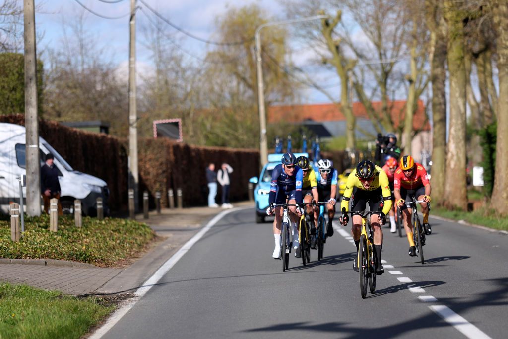 WAREGEM, BELGIUM - MARCH 27 : during the UCI World Tour Flanders Classics 78th Dwars door Vlaanderen, a cycling race with start in Roeselare and finish in Waregem on March 27, 2024 in Waregem, Belgium, 27/03/2024 ( Motordriver Kenny Verfaillie - Photo by Tomas Sisk / Photo News