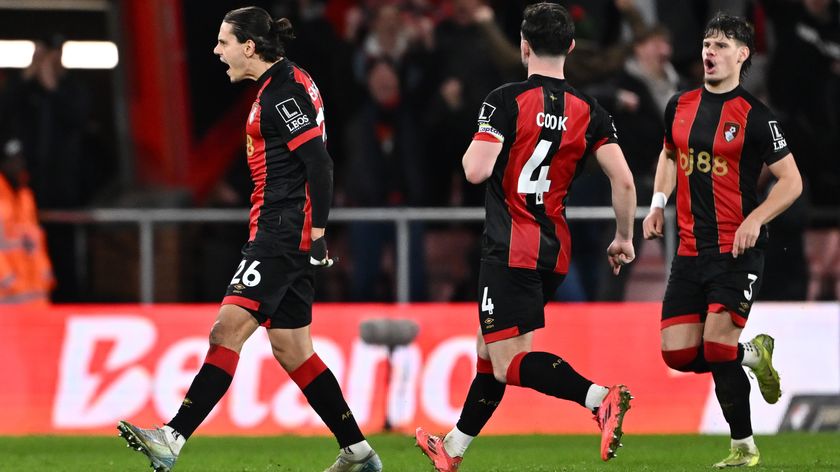 Three Bournemouth players celebrate a goal against West Ham