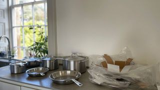 The Made In 10-piece Stainless Steel Pan Set unboxed on the work surface