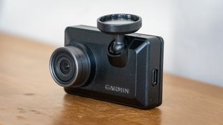 Garmin Dash Cam X310 on a wooden table