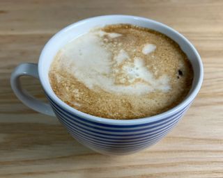 Making a cafe latte with the EspressoWorks coffee maker