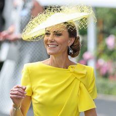 Princess Kate wearing a bright yellow dress and a matching hat for Royal Ascot Day 2 in 2026, while Prince William wears a traditional suit with a top hat