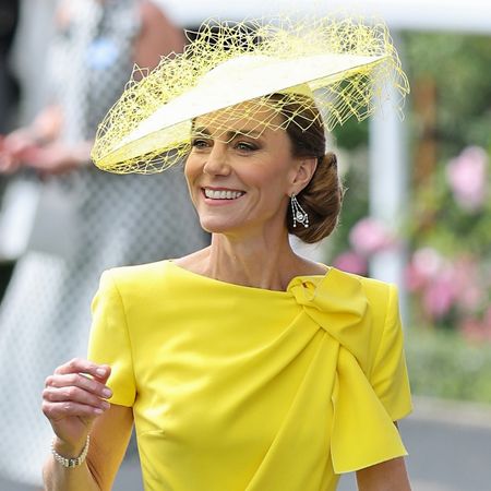 Princess Kate wearing a bright yellow dress and a matching hat for Royal Ascot Day 2 in 2026, while Prince William wears a traditional suit with a top hat