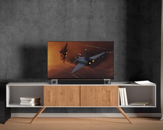 Modern wood and white TV stand with Klipsch soundbar and grey walls
