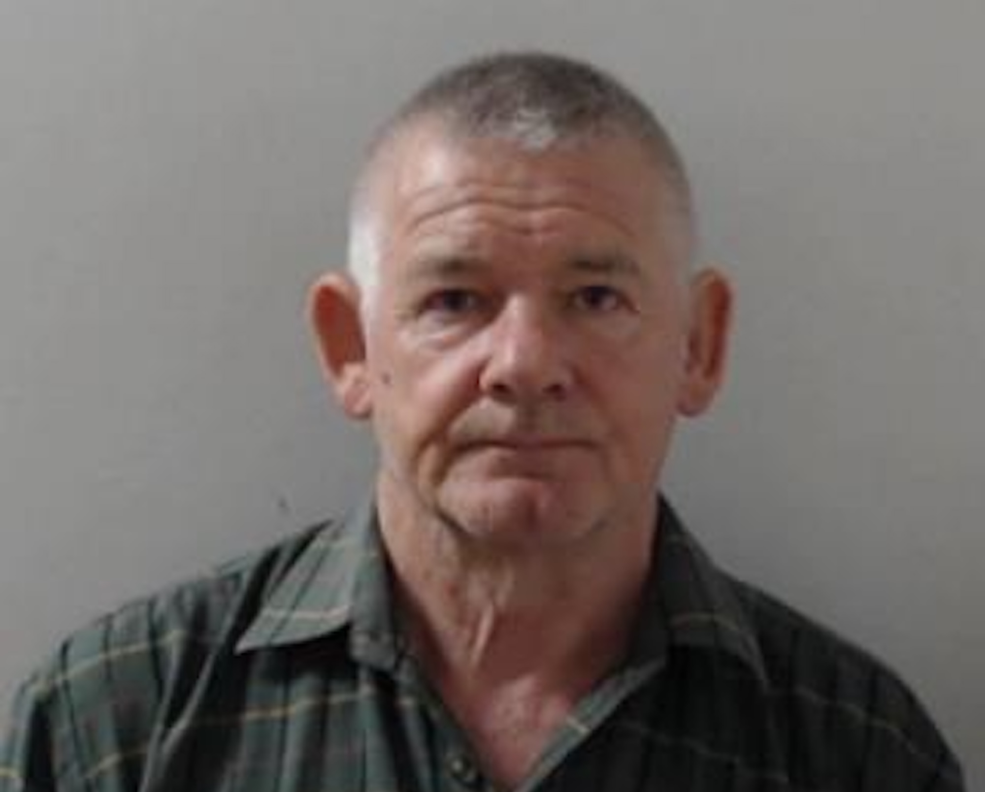 A police mug shot of Malcolm Sloss