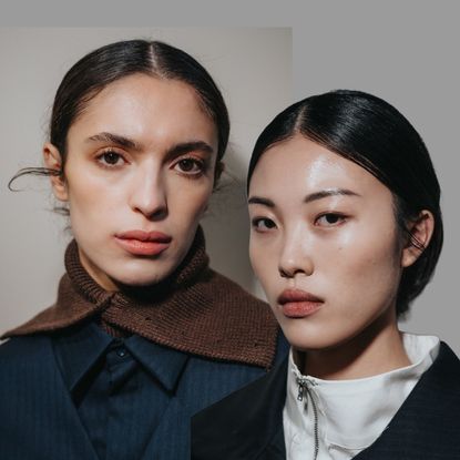 two women with glowing skin and lip stains wearing navy blue outfits