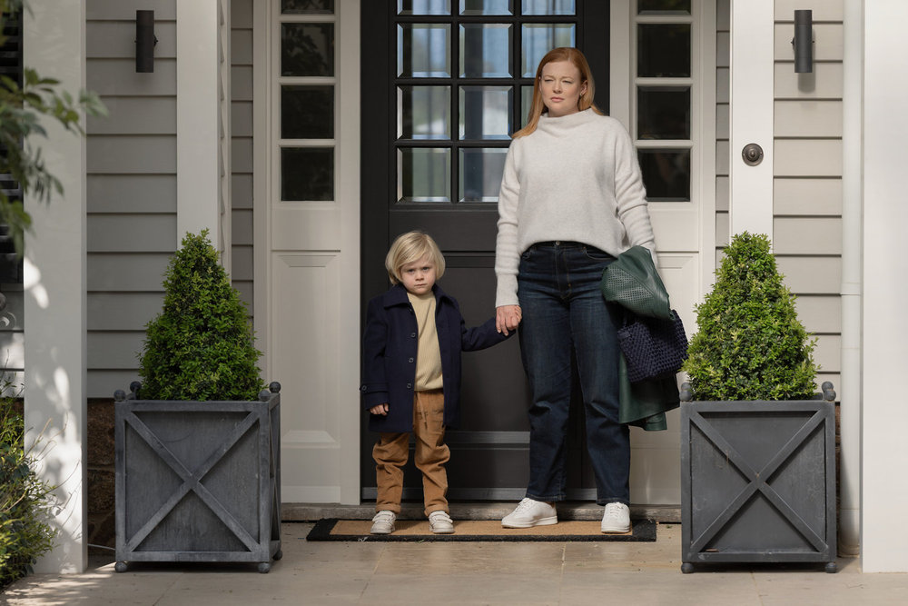 milo and his mom marissa stand outside the front door of their home in all her fault