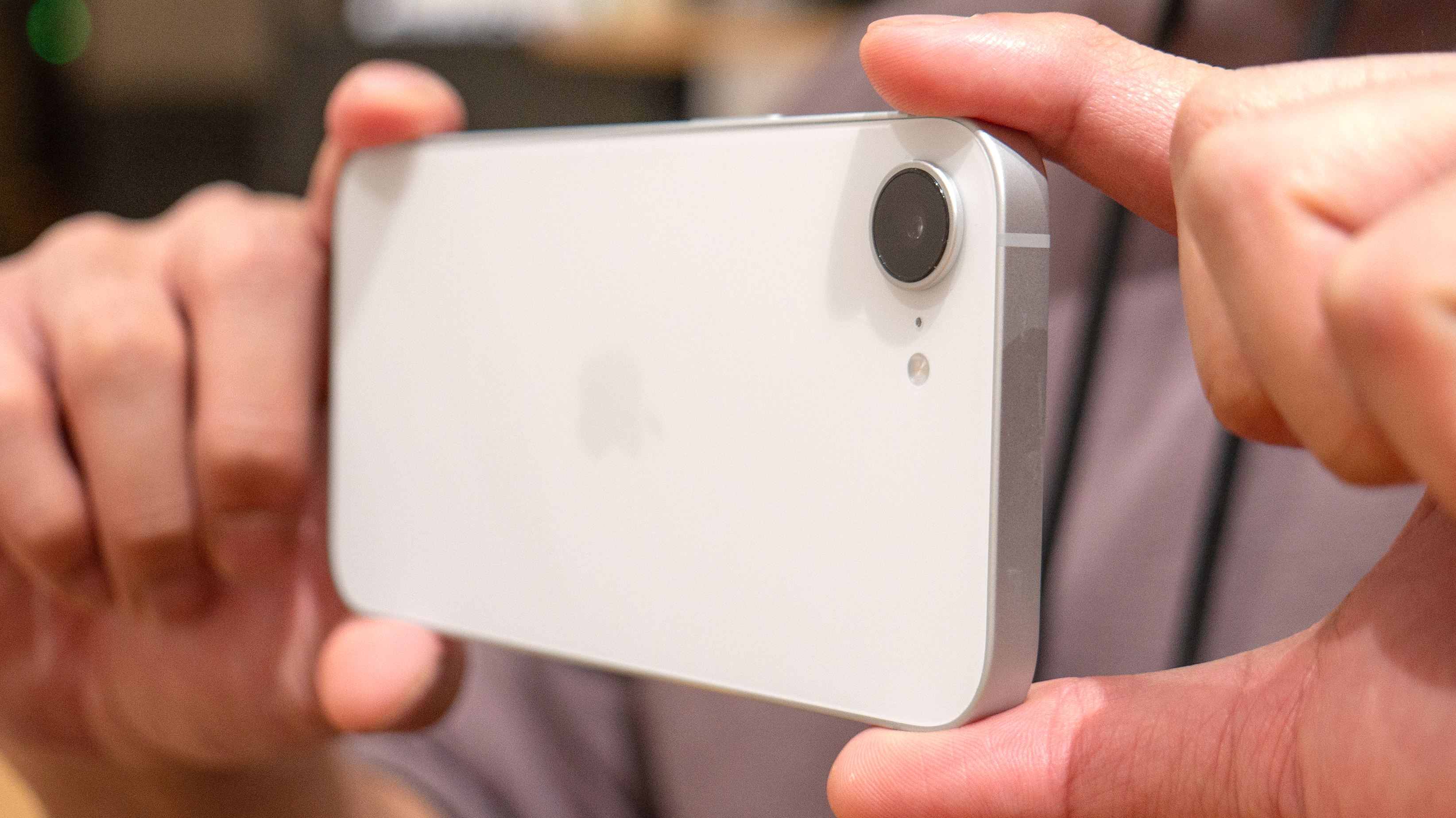 Apple iPhone 17e taking a photo.