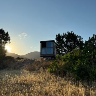 The COCOON-Freelancer, a mobile retreat on a hillside in sunshine