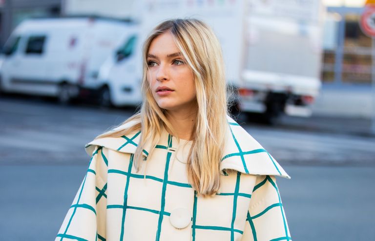 Camille Razat is seen wearing checkered cape outside Lanvin during Paris Fashion Week - Womenswear Fall/Winter 2020/2021 : Day Three on February 26, 2020 in Paris, France