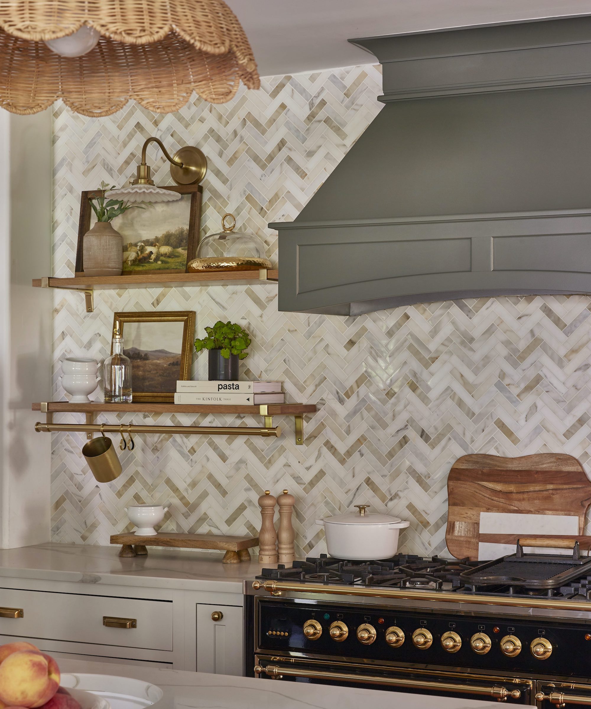 close up of herringbone tile backsplash with black stove