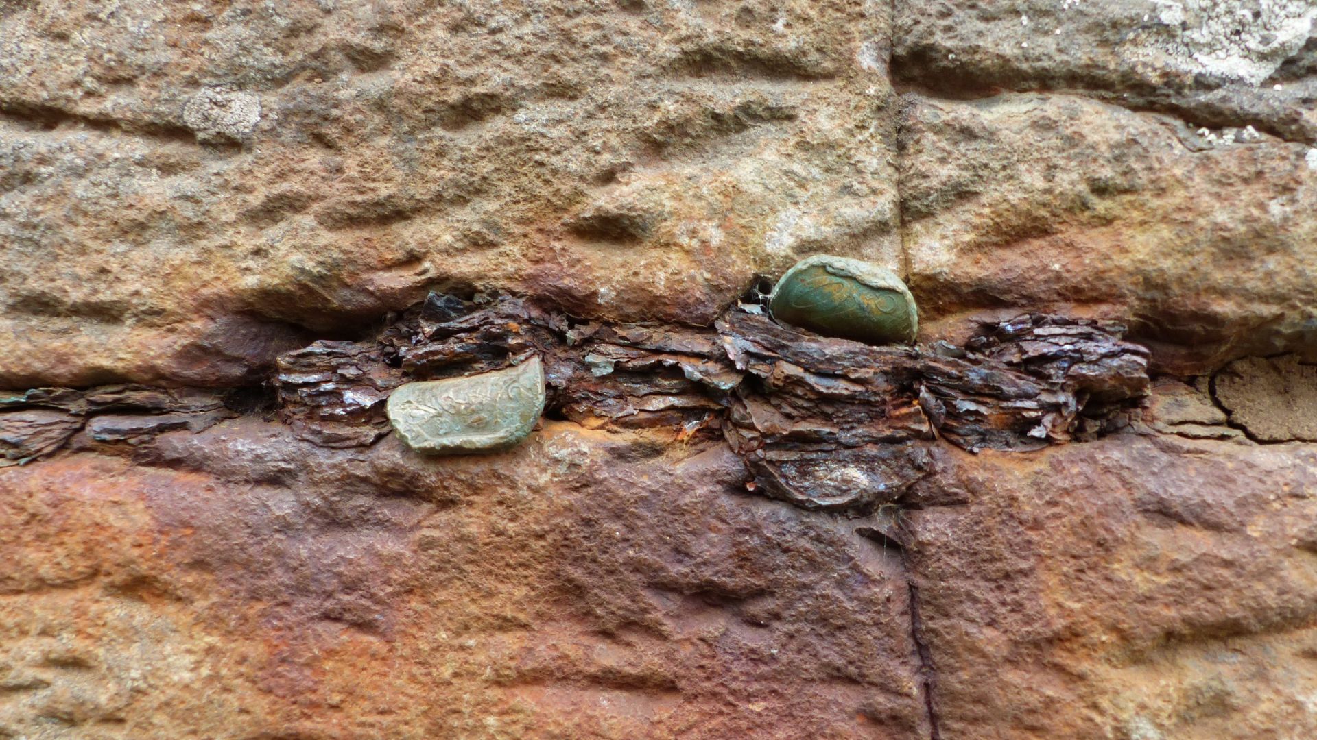 Coins wedged into cracks in Giant's Causeway