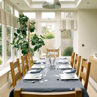 dining room in edwardian home with dining table and wooden chairs