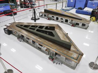SNC's Dream Chaser Spaceplane wings are unboxed in Colorado.