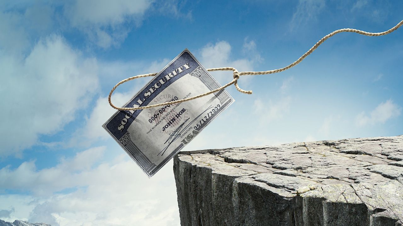 A Social Security card is balanced on the edge of a cliff, and a lasso encircles it, ready to pull it back.