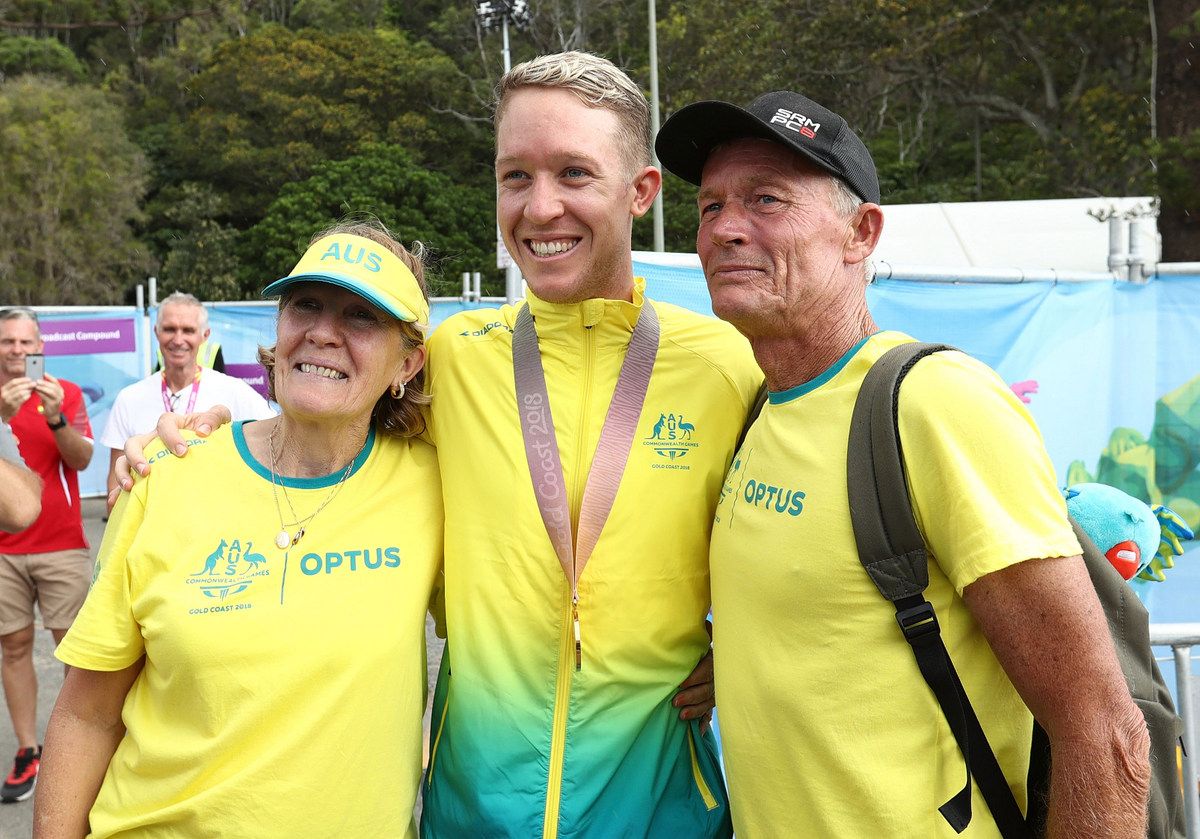 Cameron Meyer with his parents after winning gold