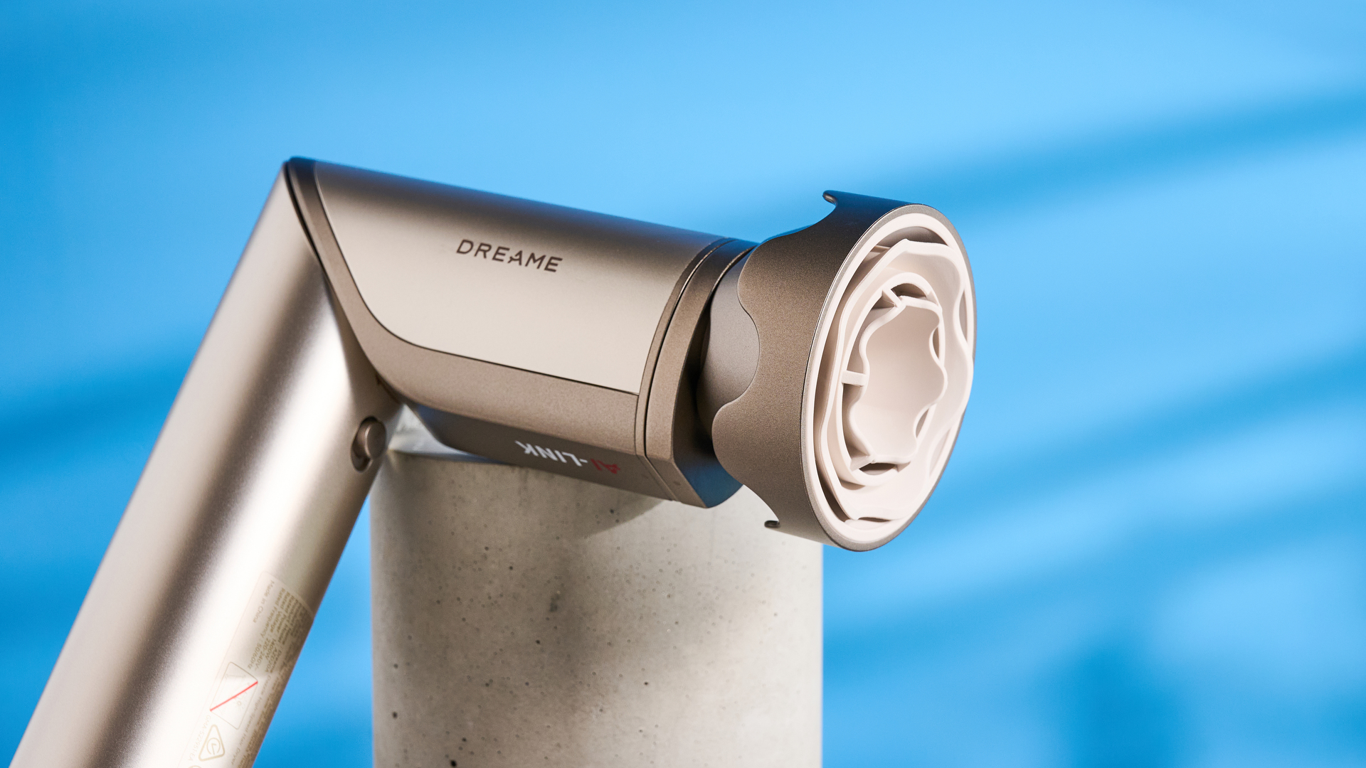 Dreame Dazzle air styler photographed in front of a blue background