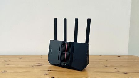 Asus RT-BE92U router on wooden table