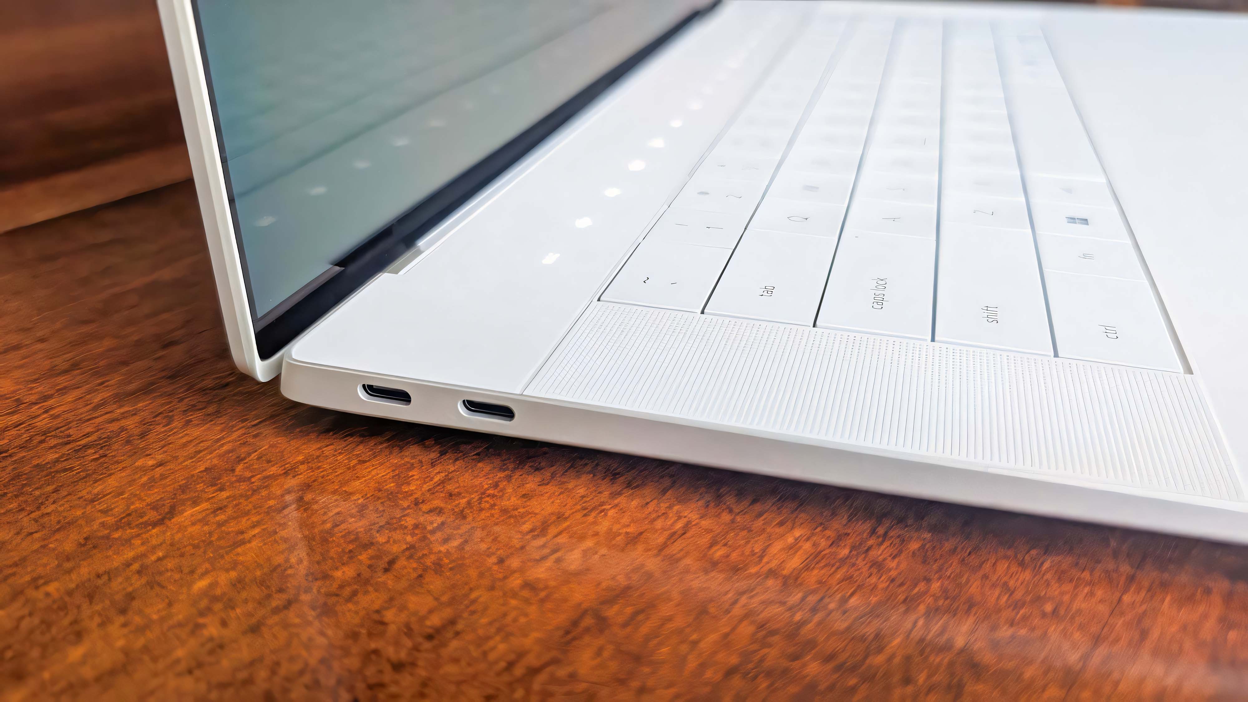 Closeup of the Dell 16 Premium's two Thunderbolt USB-C ports on the laptop's right side.