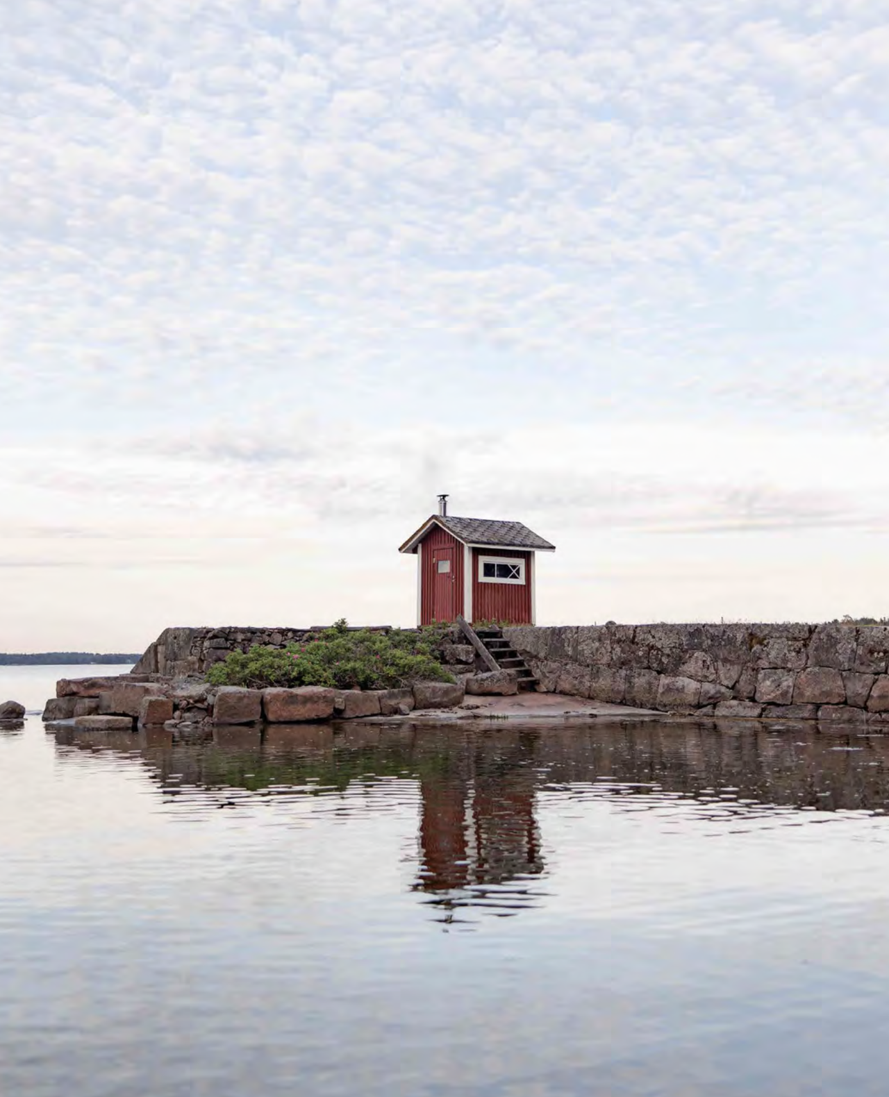 red sauna by rocky beach part of the month&#039;s best architecture books