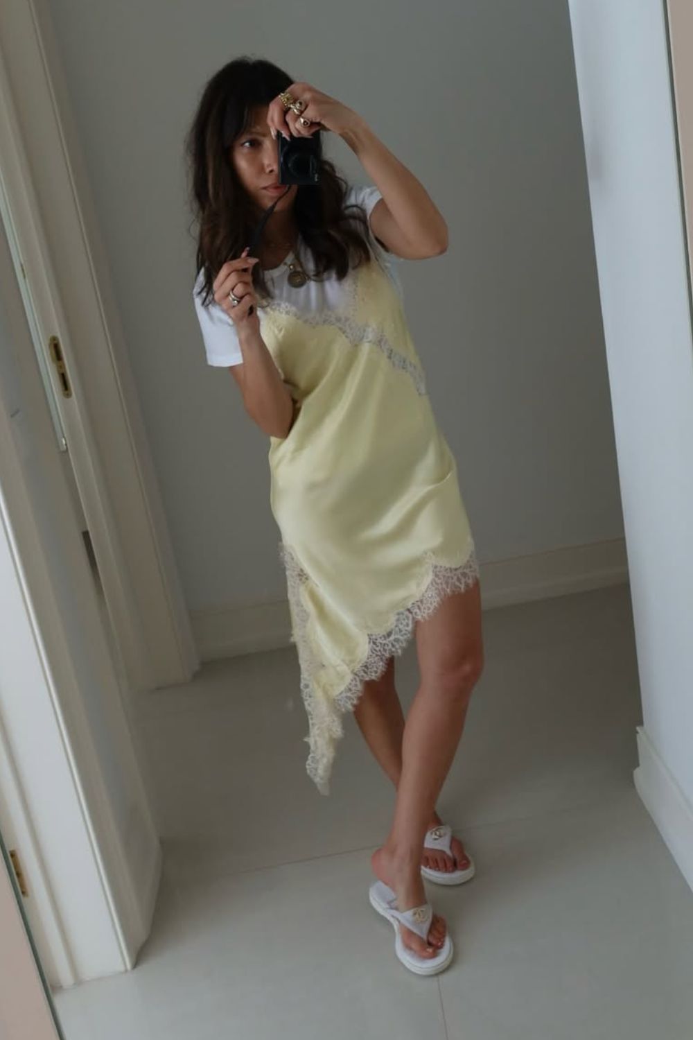 @leivankash wearing butter yellow lace slip dress