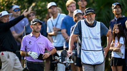 Brian Harman (left) and his caddie Scott Tway wait on the tee box at the 2025 Players Championship