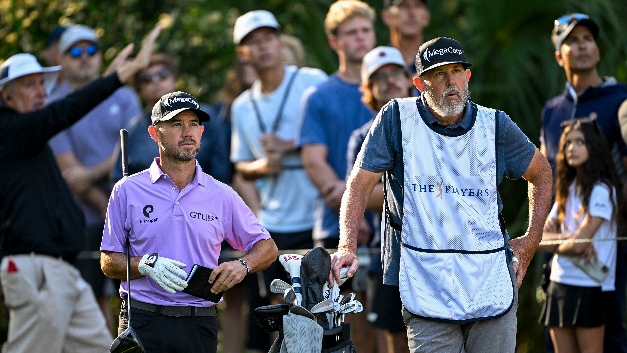 Brian Harman (left) and his caddie Scott Tway wait on the tee box at the 2025 Players Championship