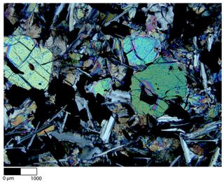 A thin section of an Apollo moon rock showing unshocked olivine and plagioclase.
