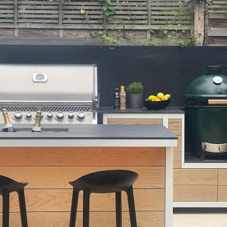 Outdoor kitchen island with ice bucket in middle