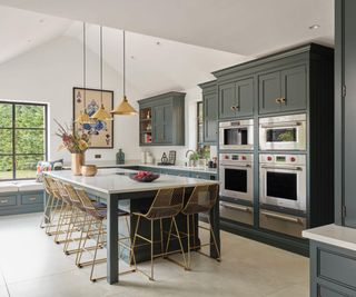 Green kitchen with gold hardware