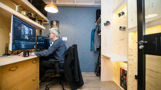 Man sitting in office using computer