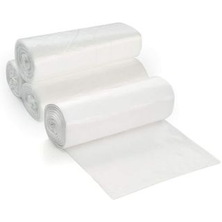 Four rolls of clear plastic bags in a stack