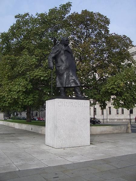 Unsurprisingly this bloke was recently voted the Greatest Ever Briton Sir Winston Churchill keeps an eye on the Houses of Parliament