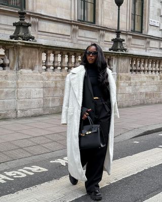 @ coco_floflo wearing wide leg trousers with Chelsea boots