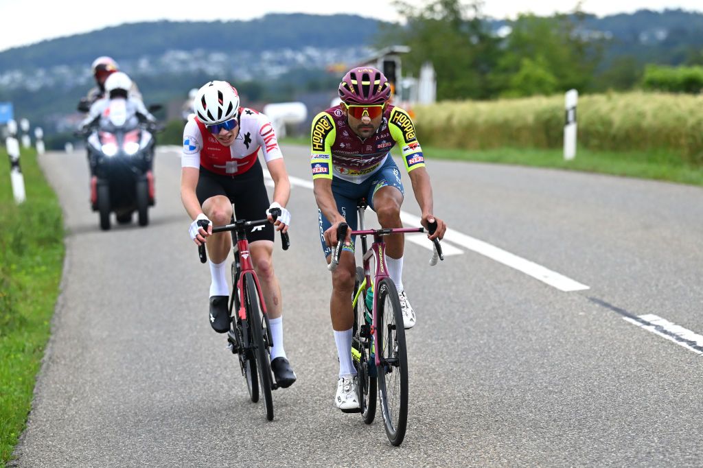 RUSCHLIKON SWITZERLAND JUNE 11 LR Luca Jenni of Switzerland and Team Suiza and Marco Murgano of Italy and Team Corratec Vini Fantini compete in the chase group during the 87th Tour de Suisse 2024 Stage 3 a 1617m stage from Steinmaur to Ruschlikon UCIWT on June 11 2024 in Ruschlikon Switzerland Photo by Tim de WaeleGetty Images