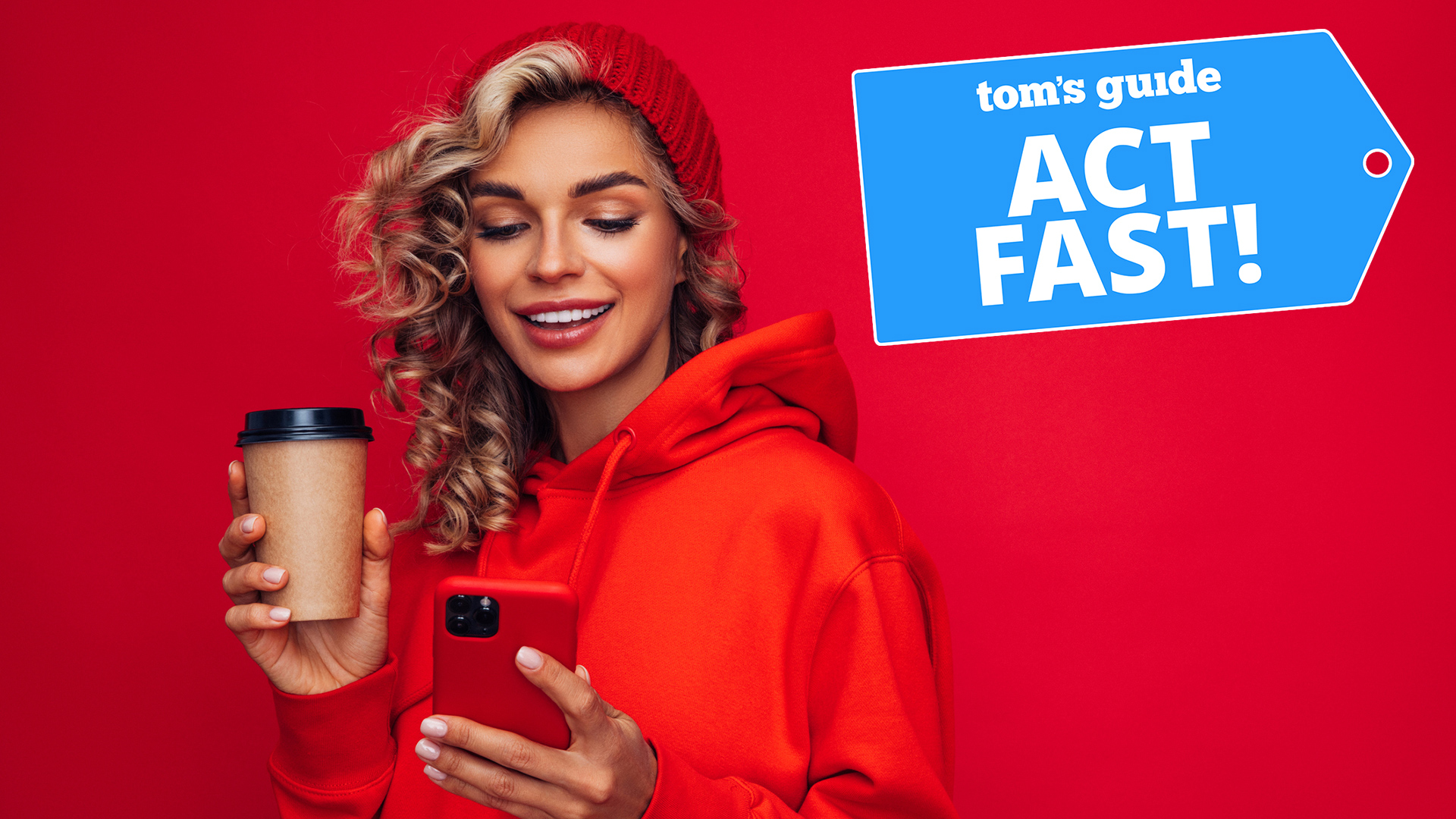 Woman in red beanie and red hoodie holding a coffee cup while looking at her phone against a red background with 'Act Fast' badge overlaid